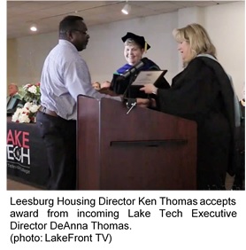 Ken Thomas accepts award from incoming Lake Tech Exec Dir DeAnna Thomas